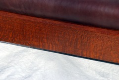 View of fine quarter sawed white oak wood grain in the front seat rail, as throughout.